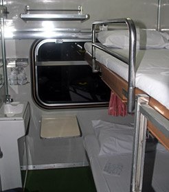 Thai 1st class sleeper in night mode with beds made up