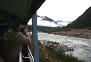 Taking photos from the open-air viewing platform on the Tranz-Alpine train