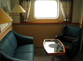 Seating area in a Hurtigruten deluxe cabin