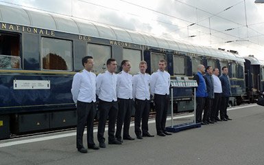 A line-up of VSOE train staff greets passengers at Calais