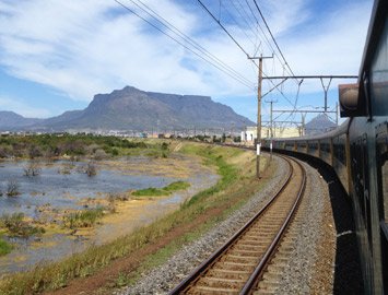 A Cape Town to Johnaeesburg train speeds away from Cape Town